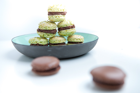 Home-made pistachio macaroons on plateの写真素材