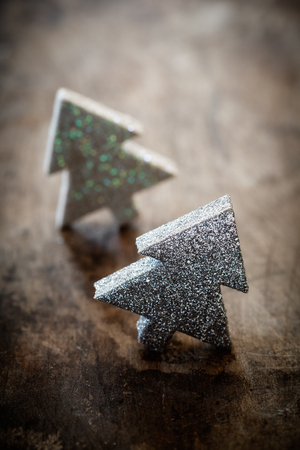 Christmas trees on wooden backgroundの写真素材