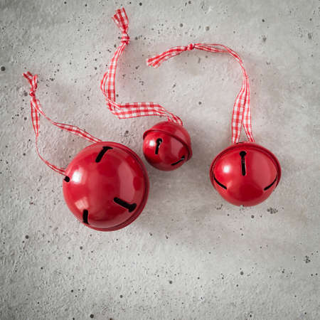 Christmas decoration, bells on concrete, copy spaceの写真素材