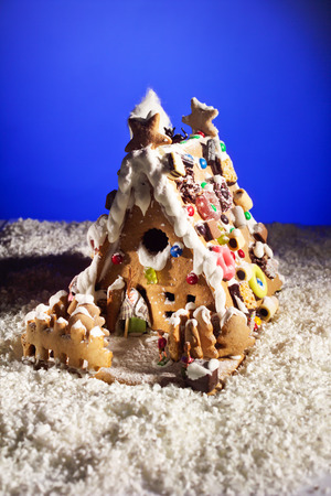 Gingerbread house on artificial snowの写真素材