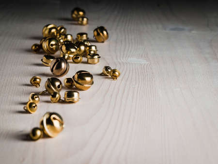 Christmas decorations, bells on white woodの写真素材