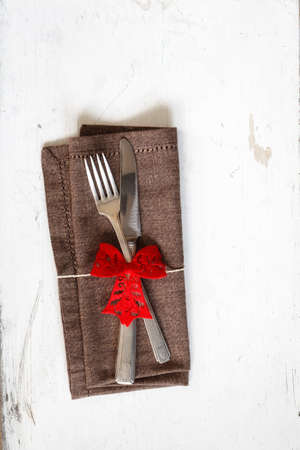 Christmas time, decorated cutlery, brown napkin, copy spaceの写真素材
