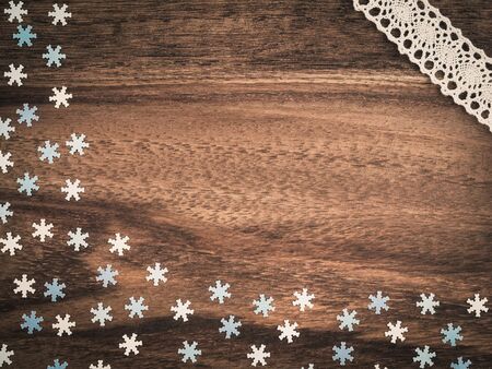 Christmas, paper snowflakes on wood, laceの写真素材