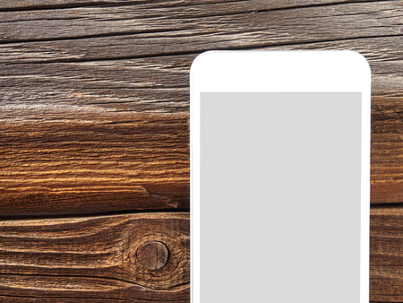 Smartphone on woodの写真素材