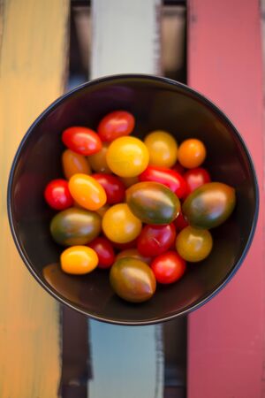 Various mini tomatoes in bowlの写真素材