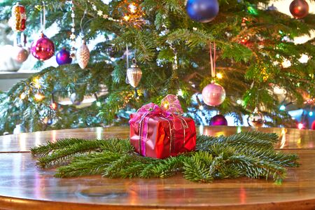Red christmas present, Christmas treeの写真素材