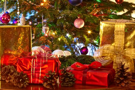 Christmas presents and cones, Christmas treeの写真素材