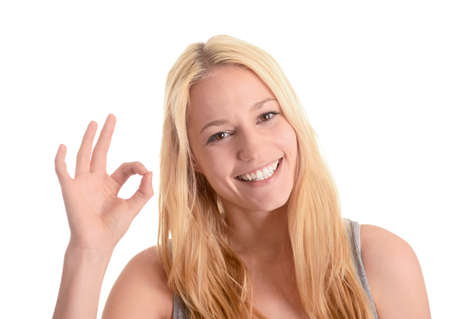 Young woman showing ok signの写真素材