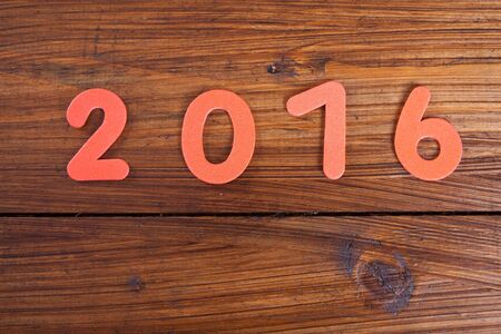 Year 2016, wooden background, copy spaceの写真素材