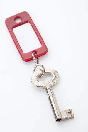 Key with key ring on white backgroundの写真素材
