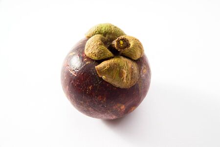 Mangosteen, whole, white backgroundの写真素材