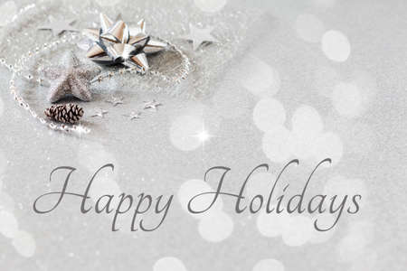 Christmas arrangement with decorations, silver, english wishesの写真素材