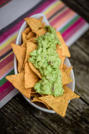 Taco chips with guacamoleの写真素材