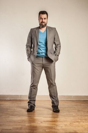 Mature business man with beard, standing confidentの写真素材