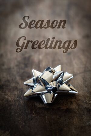 Christmas decoration, ribbon on wood, English wishes, Season greetingsの写真素材