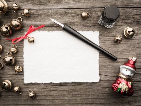 Christmas decoration, card, inkwell, quill and bellsの写真素材