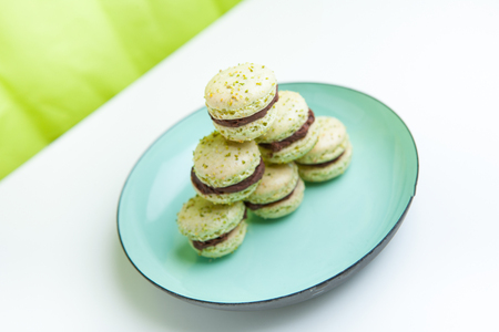 Home-made pistachio macaroons on plateの写真素材