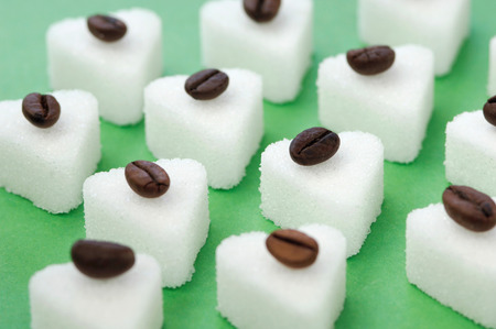Coffee beans on sugar cubes, close-upの写真素材