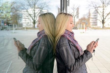 Young woman with smartphone in Berlinの写真素材