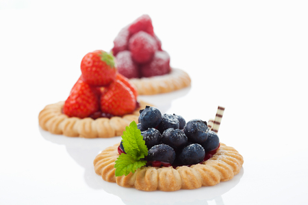 Tarts with blueberries, strawberries and raspberriesの写真素材