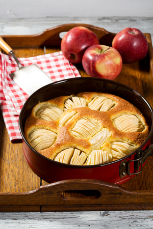 Apple pie in baking dish on tabletの写真素材