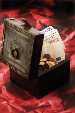 Treasure box full of moneyの写真素材