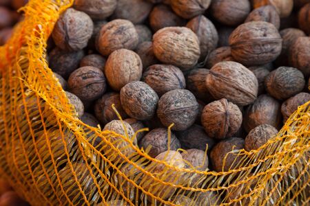 Walnuts in netの写真素材