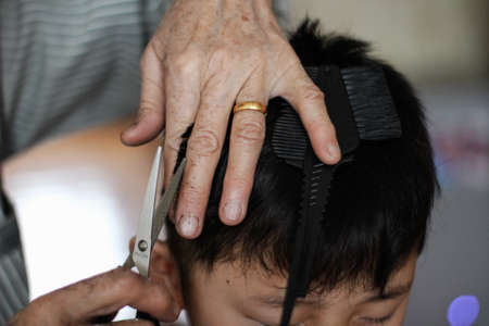 hairdresser with scissorsの写真素材