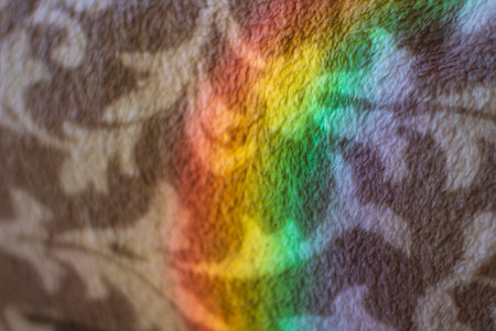 Rainbow on the wall as an abstract background. Macro image.の写真素材