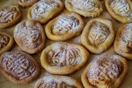 Mongolian Boov with Ornament Close-up. Baked Cookies in powdered sugar.