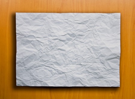 White Crumpled Paper on the Wood Backgroundの写真素材