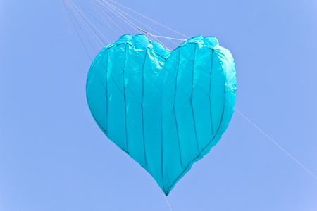 love heart kite against blue sky