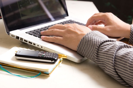 hands of Business man typing on notebook