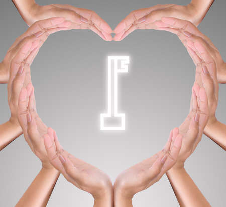 key icon in hand heartの写真素材