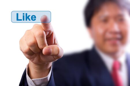 business man pushing  like buttonの写真素材
