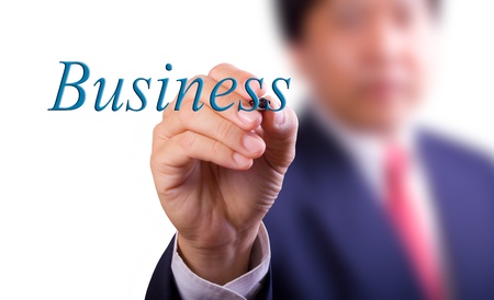 business man writing business wordの写真素材