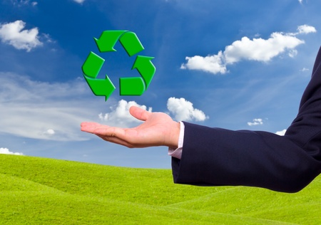 business man hand and recycle sign for green world conceptの写真素材