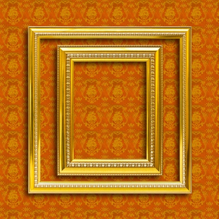 frame of golden wood  on yellow wallpaper