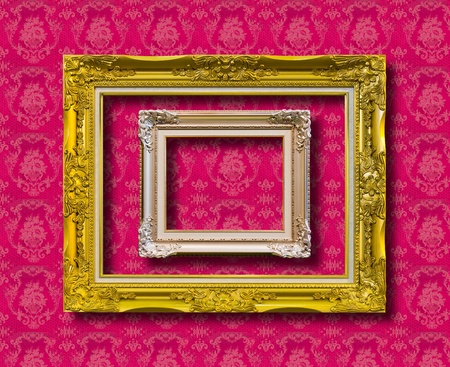 frame of golden wood on pink wallpaper with clipping pathの写真素材