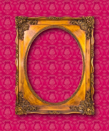 frame of golden wood on pink wallpaper の写真素材