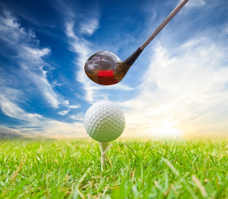 driver hit golf ball on teeの写真素材
