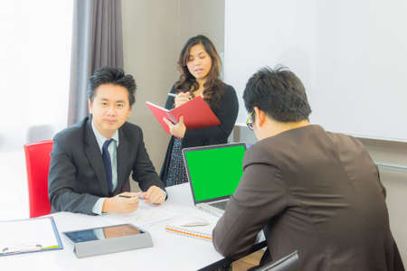 business partners discussion with notebook and documents  at meetingの写真素材
