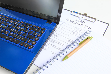 computer notebook with loan applicationの写真素材