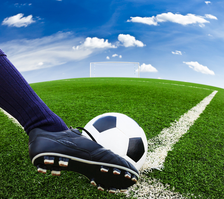 foot kicking soccer ballの写真素材