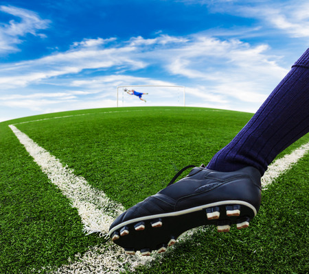 foot kicking soccer ballの写真素材