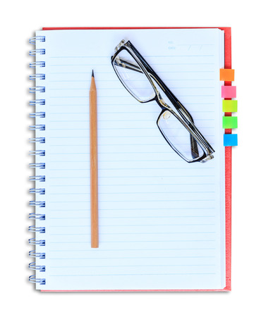 red notebook pencil and eyeglasses isolated on white background with clipping pathの写真素材