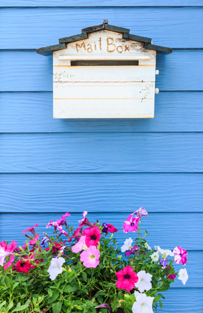 wooden mailbox on blue wood wall backgroundの写真素材