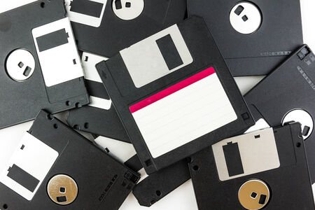 black diskette isolated on white backgroundの写真素材