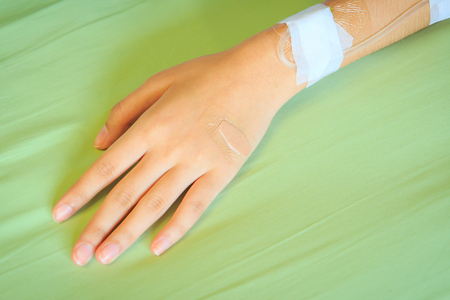 hand with saline solutionの写真素材