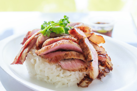 Grill pork with rice and spicy sauceの写真素材
